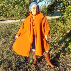 Orange fleece cape with attached scarf
